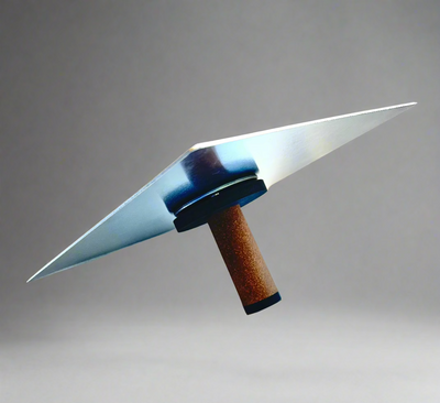 NELA aluminum hawk with cork handle, angled side view on gray background