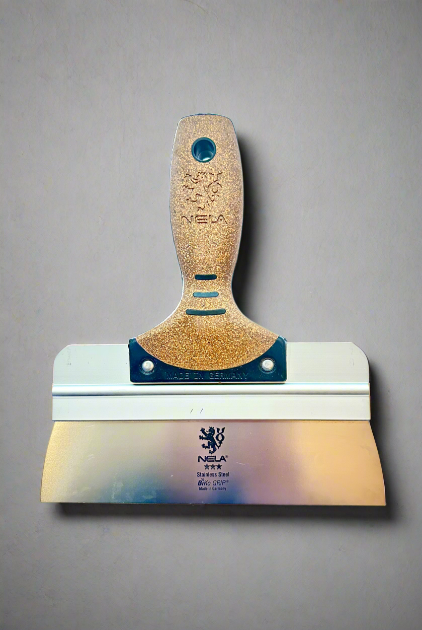 NELA square corner taping spatula with cork handle, front view of blade with NELA logo