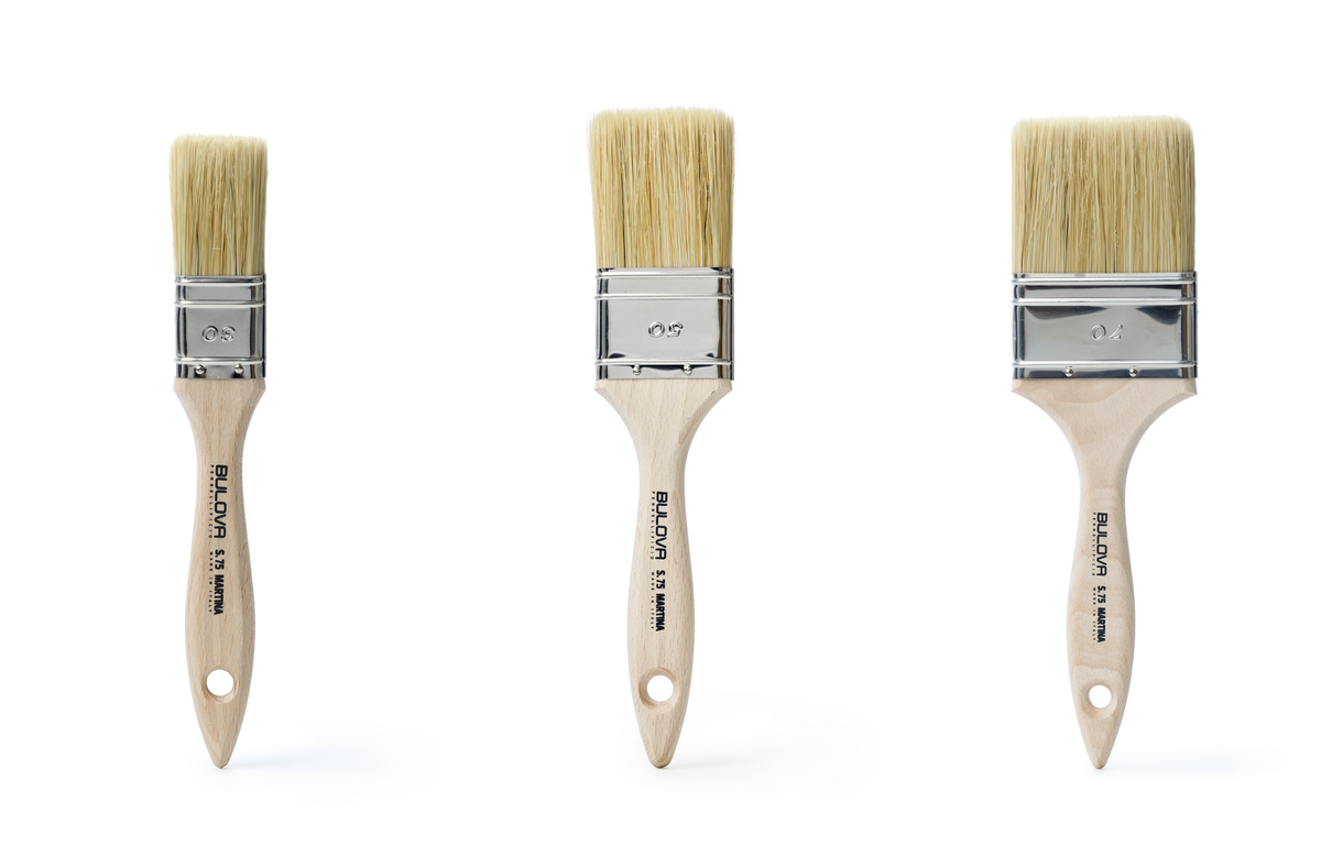 Three ICR Martina flat brushes in graduated widths with natural bristles and pale wood handles