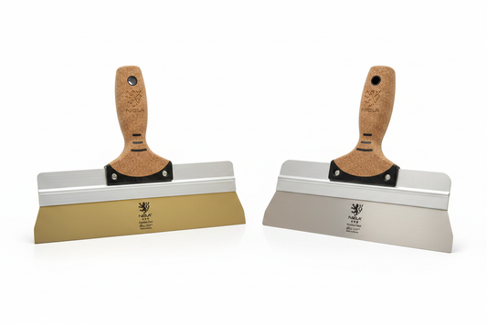 NELA taping knives gold and silver side by side on white background